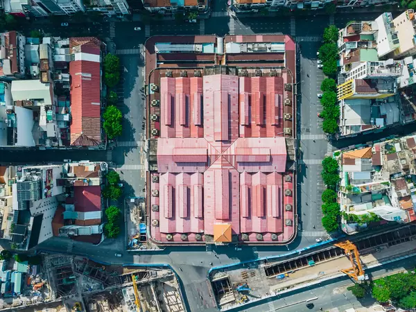 Top View Drone Photo of the famous Ben Thanh Market with empty Streets next to the Saigon Metro Construction in the City Center of Ho Chi Minh City, Vietnam