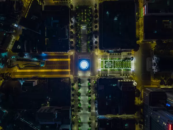 Top View Drone Photo of the Saigon Opera House next to Nguyen Hue Walking Street with the Giant Lotus Water Fountain at Night in Ho Chi Minh City, Vietnam