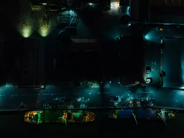 Top View Drone Photo of Transport Ships docked at the Khanh Hoi Nha Rong Port at Night in Saigon, Vietnam
