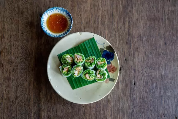 Top View Food Photo of Vietnamese Goi Cuon - Fresh Sommer Rolls on a Plate with Fish Sauce