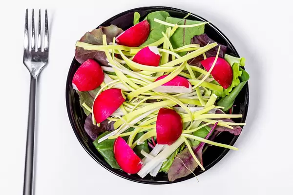 Top view fresh salad with spinach leaves, leeks and radishes (Flip 2019)