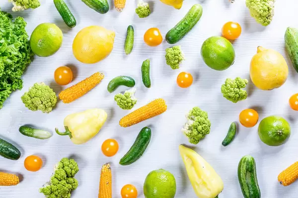 Top view fresh vegetables and fruits on white wooden background (Flip 2019)