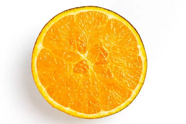 Top view, half of a chocolate orange on a white background (Flip 2020)