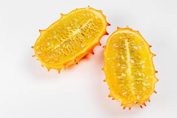 Top view, halves of kiwano fruit on a white background (Flip 2020)