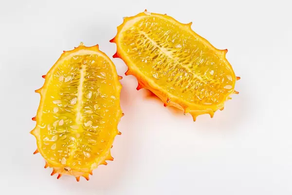 Top view, halves of kiwano fruit on a white background