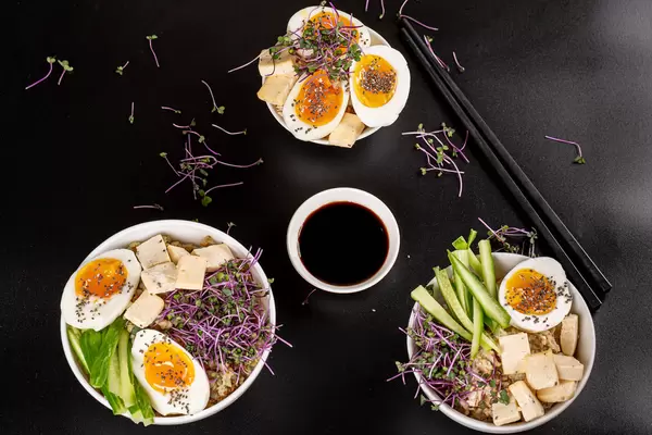 Top view healthy food or diet lunch on black background with chopsticks