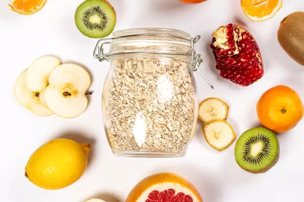 Top view, jar of oatmeal with fresh fruit