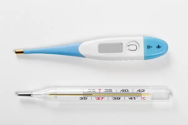 Top view mercury and electric thermometer on a white background