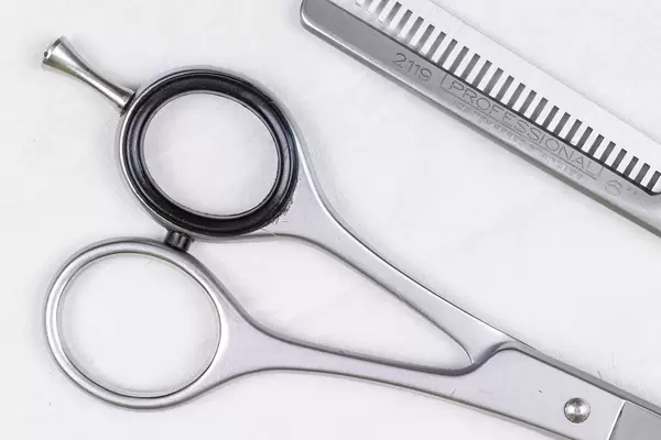 Top view Metal Haircut Scissors above white background