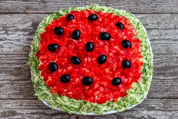 Top view Mushroom salad with tomatoes and cucumbers on an old wooden background (Flip 2019)
