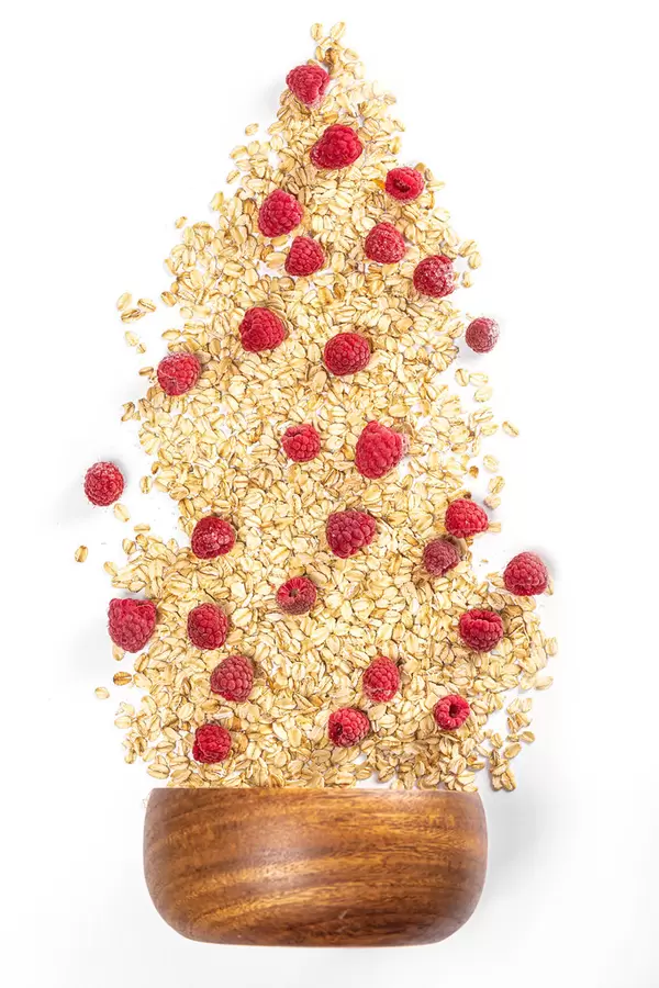 Top view, oatmeal with berries raspberry and bowl