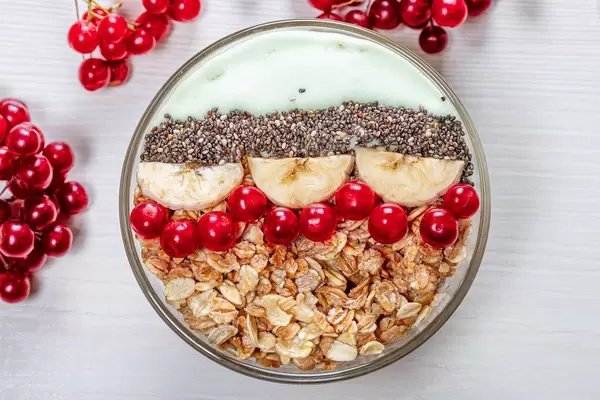 Top view oatmeal with Chia seeds, viburnum berries and banana slices (Flip 2019)