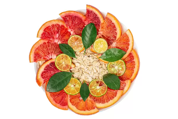 Top view, oatmeal with red orange and calamondine slices