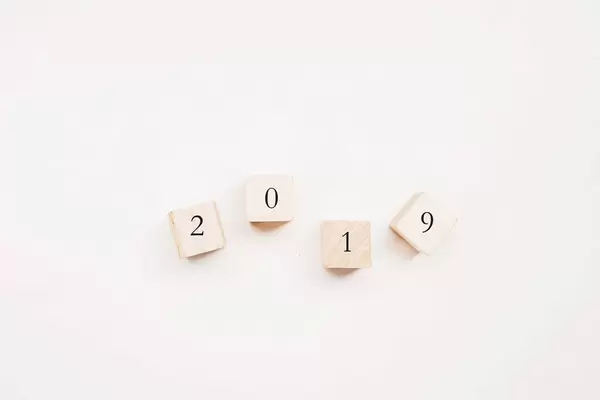 Top view of 2019 written on wooden cubes. New year concept.