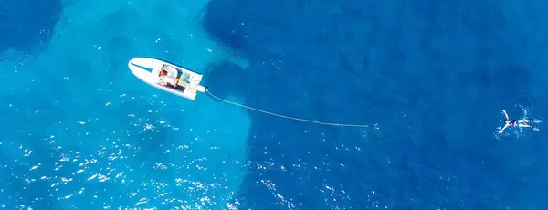 Top view of a failed attempt of water skiing in the deep blue sea of Argolic Gulf