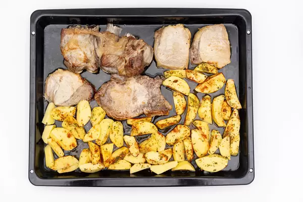 Top view of Baked Pork Ribs and Chops with Potatoes