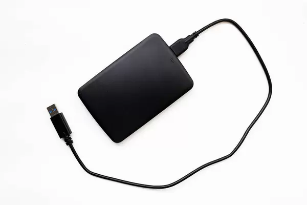 Top view of black external hard disk on white background  Flip 2019