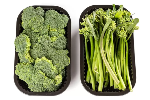 Top view of broccoli and broccolini in plastic containers