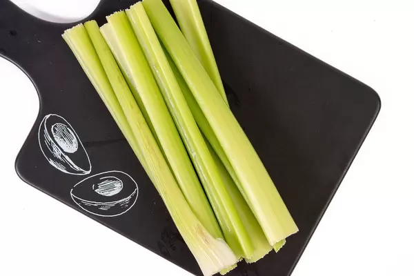 Top view of Celery Sticks on the black tray (Flip 2019)