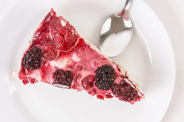 Top view of Cheesecake with Blackberries slice on the plate (Flip 2019)