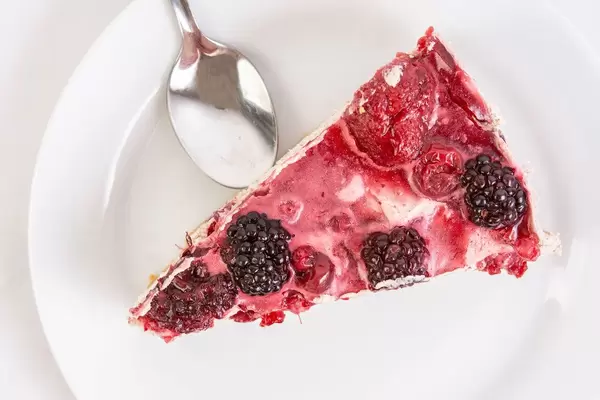 Top view of Cheesecake with Blackberries slice on the plate