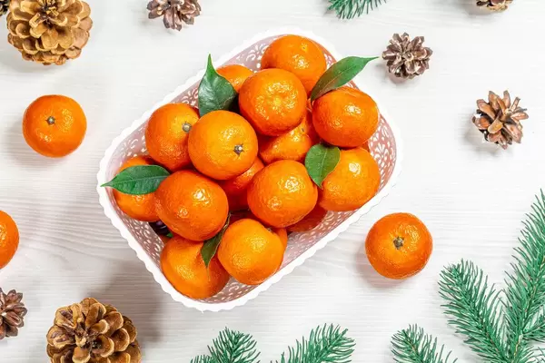 Top view of Christmas background with tangerines, pine cones and branches Christmas tree (Flip 2019)