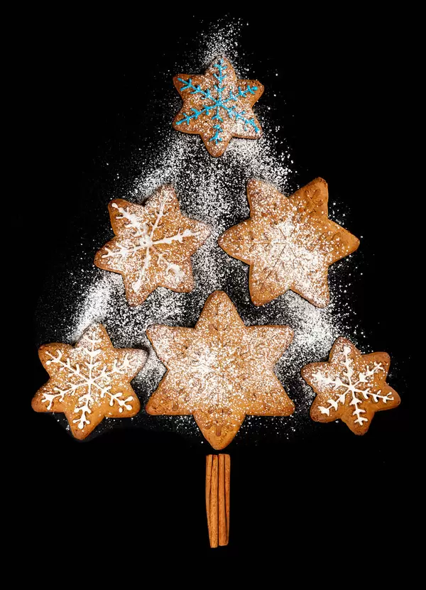 Top view of christmas tree made of gingerbread, cinnamon and powdered sugar