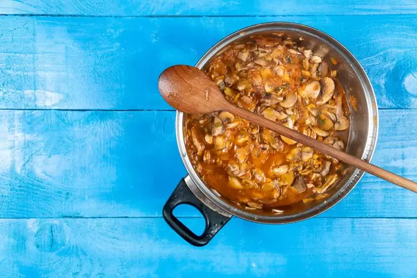 Top view of Cooked Stew with Chicken meat and Mushrooms