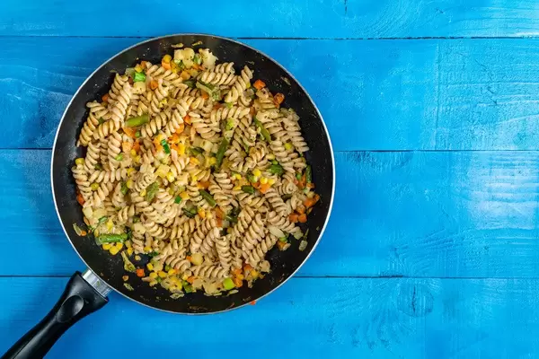 Top view of Cooked Vegetables with Pasta with Copy Space (Flip 2020)