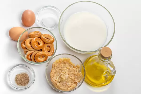 Top view of cooking ingredients on white background
