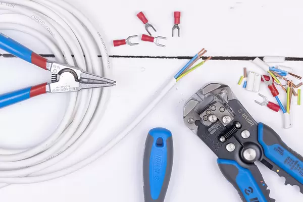Top view of Crimp Grip Pliers above white background table