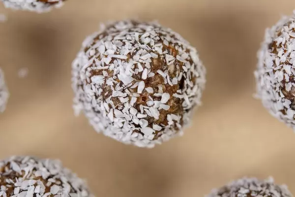 Top view of Dates and Peanut Butter energy balls in the Coconut (Flip 2019)