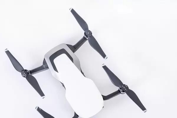 Top view of DJI Mavic Air drone on the white background (Flip 2019)