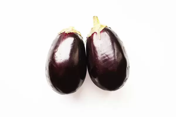 Top view of eggplants on white background