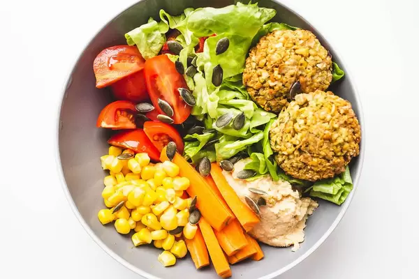Top view of falafel buddha bowl with veggies