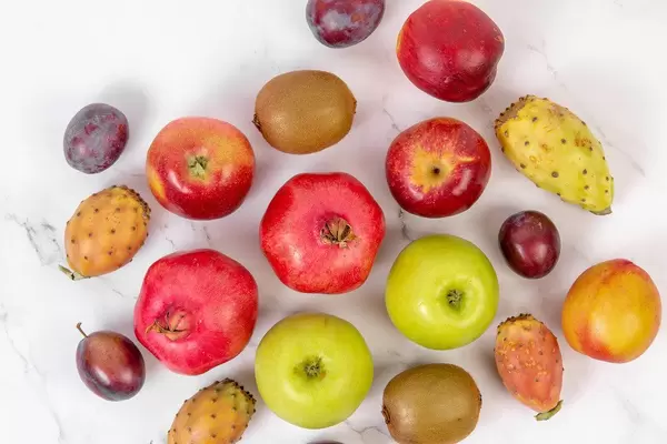 Top view of Fresh Fruits on the white table (Flip 2019)