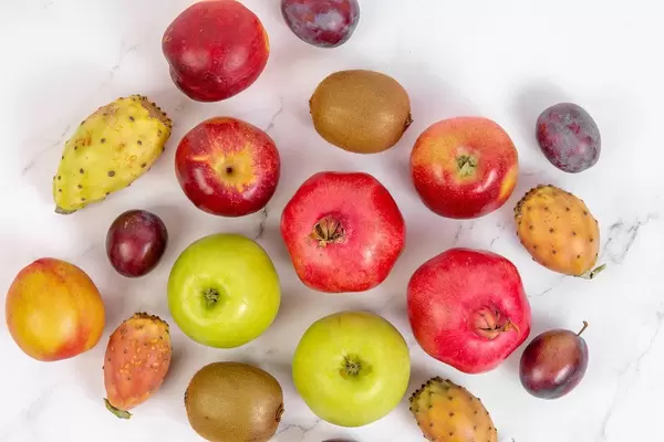 Top view of Fresh Fruits on the white table