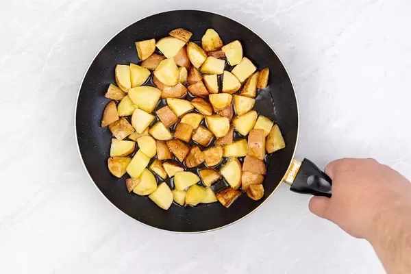 Top view of Fried Young Potatoes in the frying pan