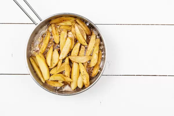 Top view of Frying Potatoes in the frying pan