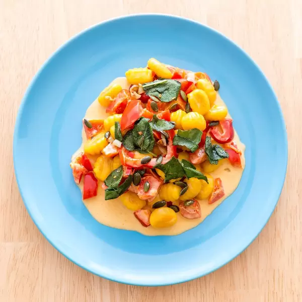 Top view of Gnocchi with pumpkin seeds in pepper sauce by Hellofresh