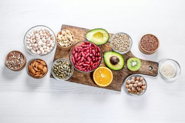 Top view of healthy food components on a white wooden table