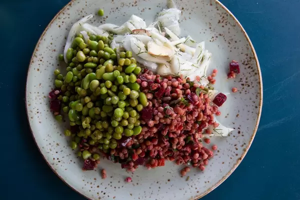 Top view of healthy food: Healthy food: Edame, green lentils, beetroot and fennel-apple on a plate