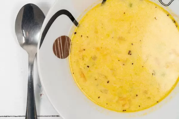 Top view of Homemade Chicken Soup with Carrot and Green Beans
