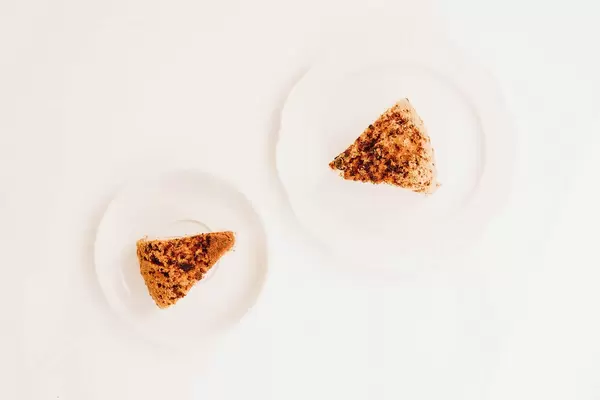 Top view of homemade pound cake slices on white background