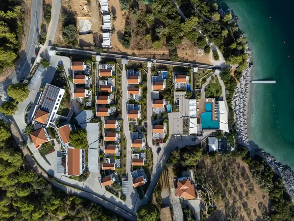 Top view of luxurious hotel at Panormos bay with a complex of villas and swimming pool: Adrina Resort & Spa