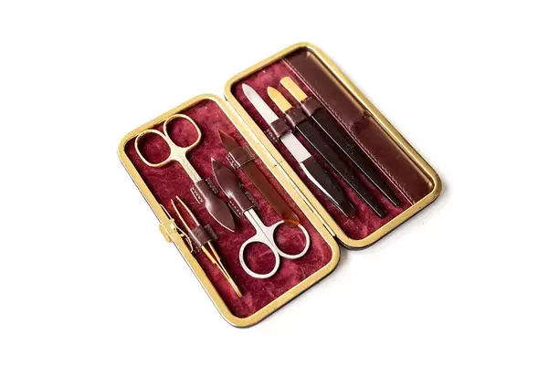 Top view of manicure set with scissors on white background (Flip 2019)
