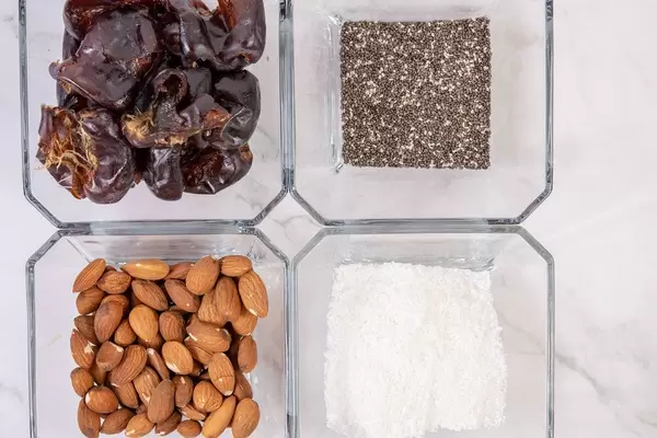 Top view of Peanut butter Almonds Coconut Chia Seeds and Dates (Flip 2019)