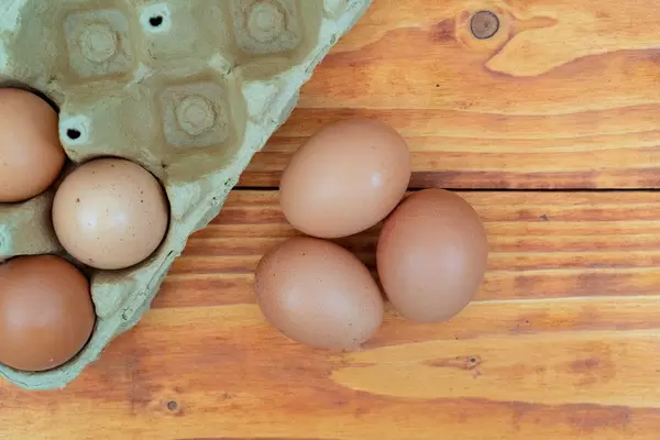 Top view of raw eggs in the cardboard box (Flip 2020)