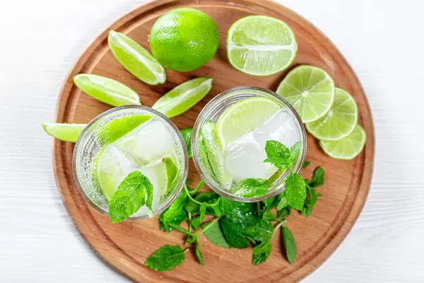 Top view of refreshing summer drink with mint and lime