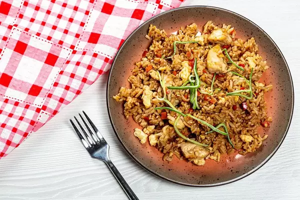 Top view of rice with chicken and vegetables